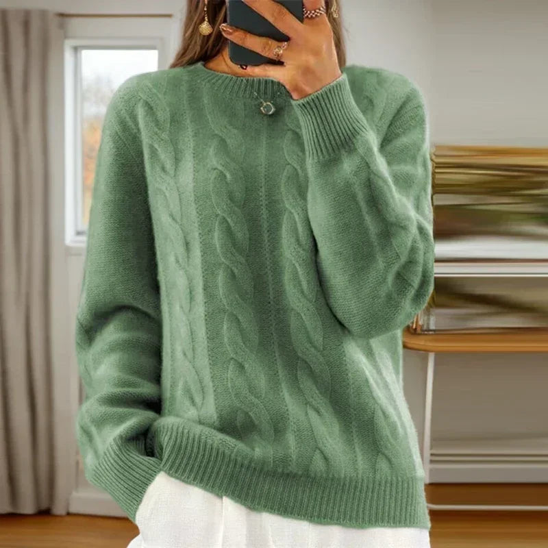 Women's cable knit crew neck sweater with long sleeves and ribbed trims