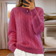 Women's cable knit crew neck sweater with long sleeves and ribbed trims