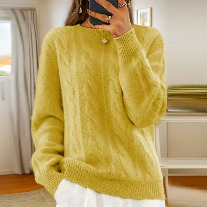 Women's cable knit crew neck sweater with long sleeves and ribbed trims