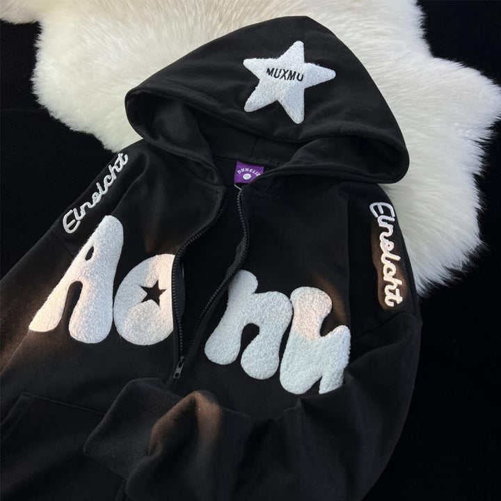 Women's hooded zip-up hoodie with raised text appliqués, star patches and kangaroo pocket