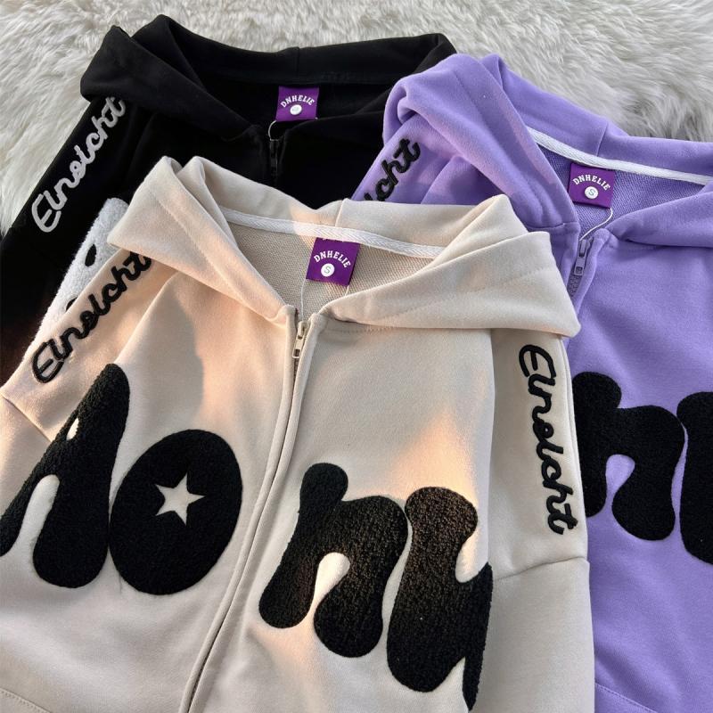 Women's hooded zip-up hoodie with raised text appliqués, star patches and kangaroo pocket