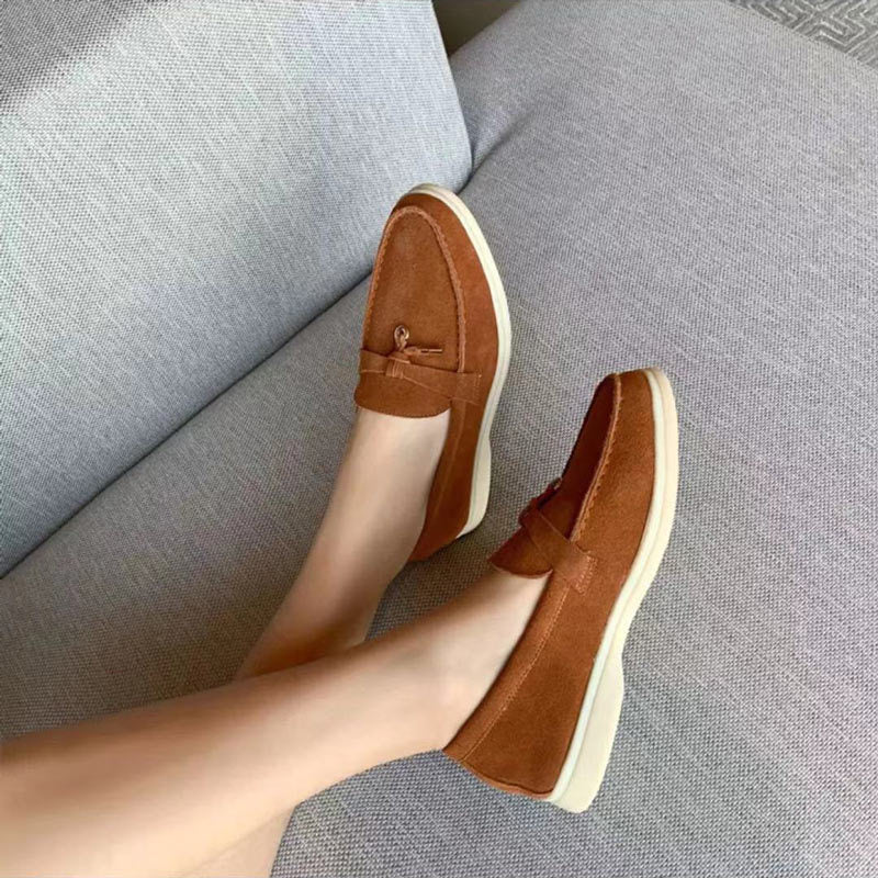 Women's pointed toe loafers with tassel detail