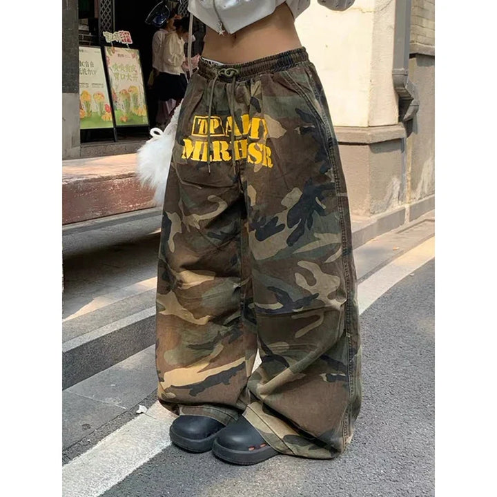 Women's wide leg camouflage trousers with drawstring waist and yellow graphic text