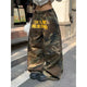 Women's wide leg camouflage trousers with drawstring waist and yellow graphic text