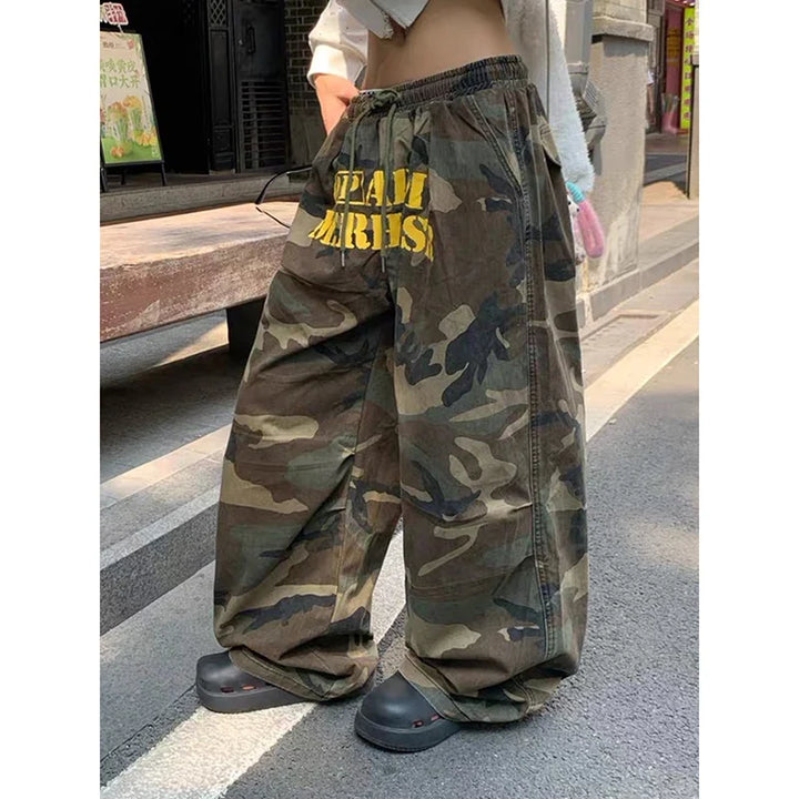 Women's wide leg camouflage trousers with drawstring waist and yellow graphic text