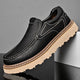 Brown and black moc-toe loafers with contrast stitching and lug soles