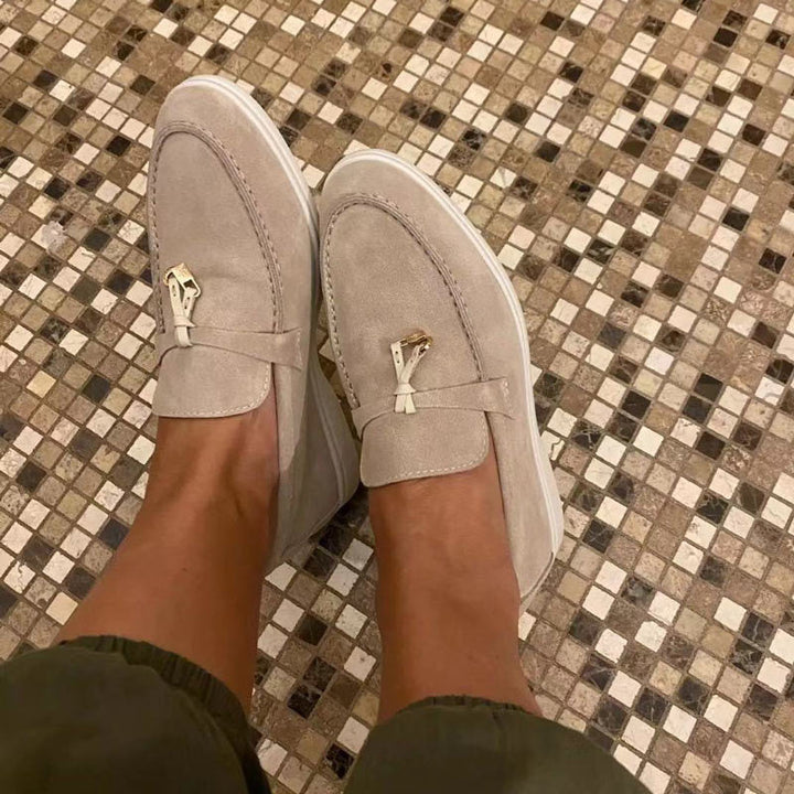 Women's pointed toe loafers with tassel detail