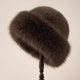 Women's fluffy fur-textured winter hat with rounded crown and wide brim