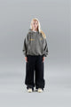 Model wearing an oversized graphic pullover hoodie with hood, long sleeves and kangaroo pocket