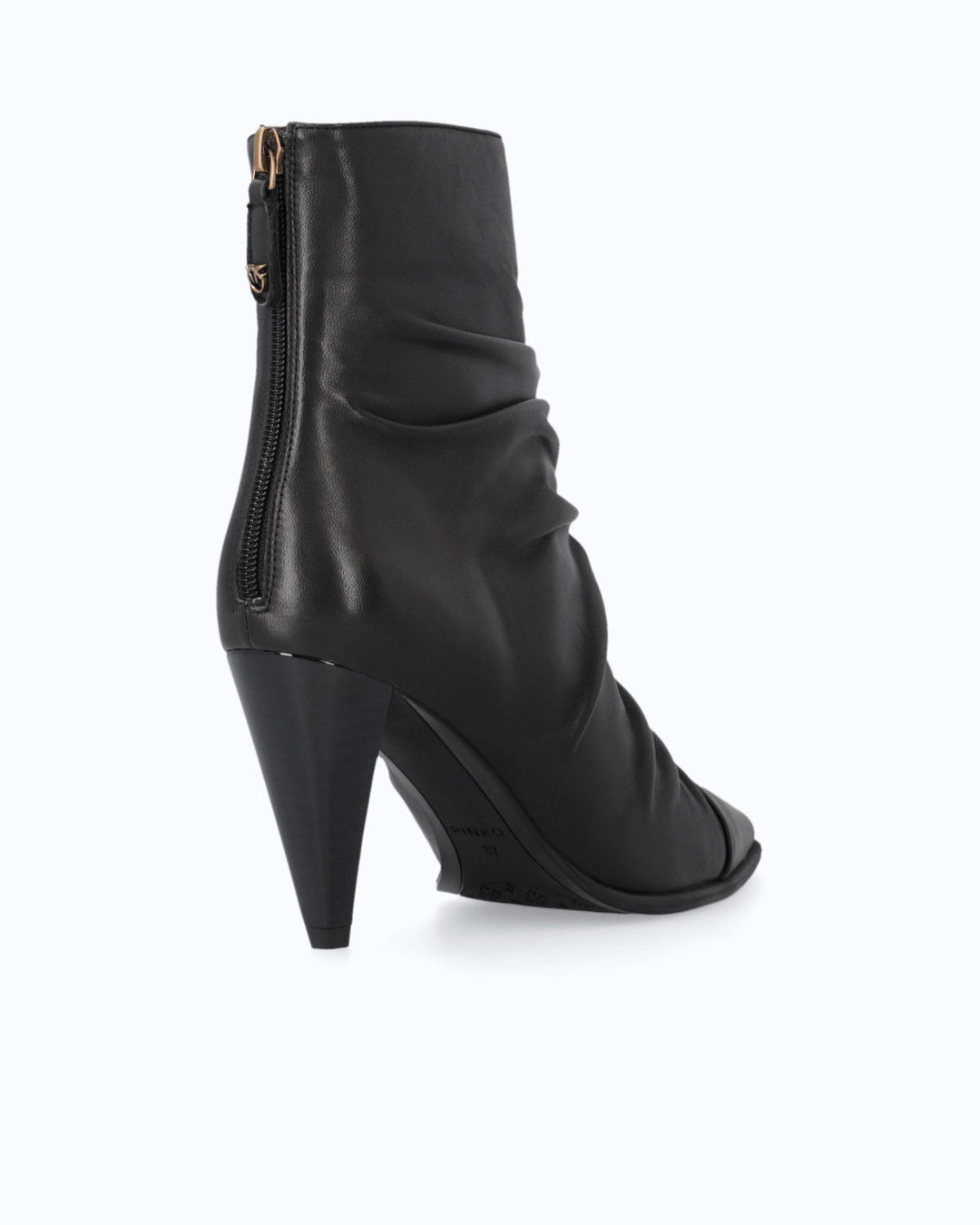 Black ruched ankle boots with pointed toes and high stiletto heels
