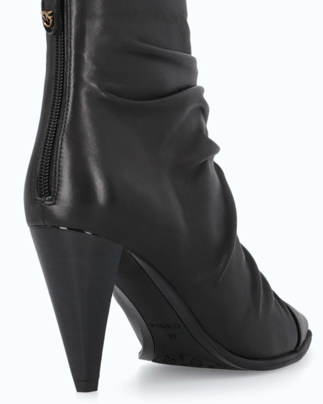 Black ruched ankle boots with pointed toes and high stiletto heels