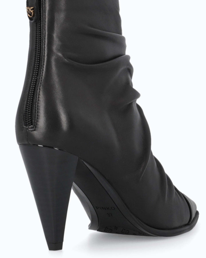 Black ruched ankle boots with pointed toes and high stiletto heels