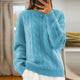 Women's cable knit crew neck sweater with long sleeves and ribbed trims