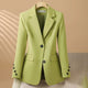 Women's tailored single-breasted blazer with notched lapels and flap pockets