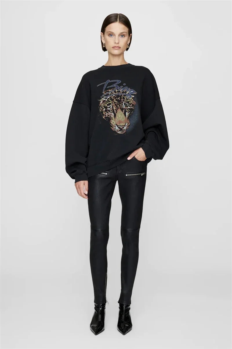 Women's long sleeve crew neck sweatshirt with front graphic detail