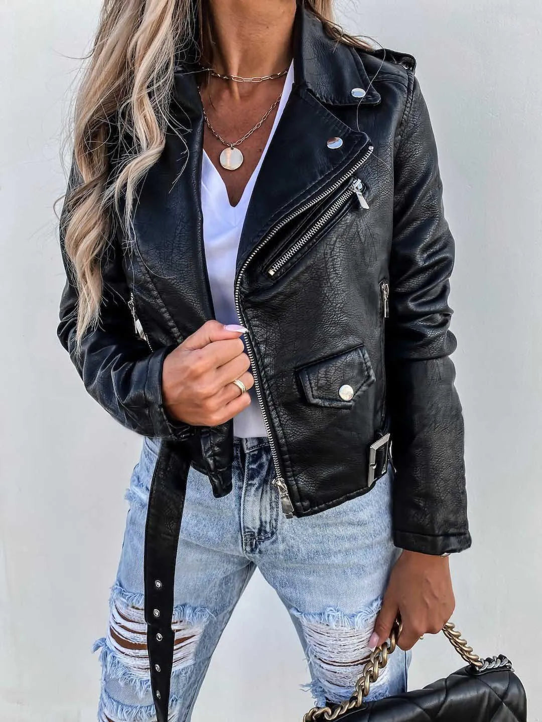 Women's cropped biker jacket with angled zip, belt and multiple pockets