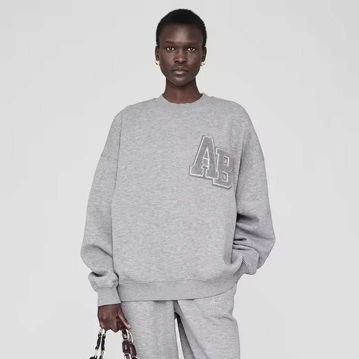 Women's long sleeve crew neck sweatshirt with front graphic detail