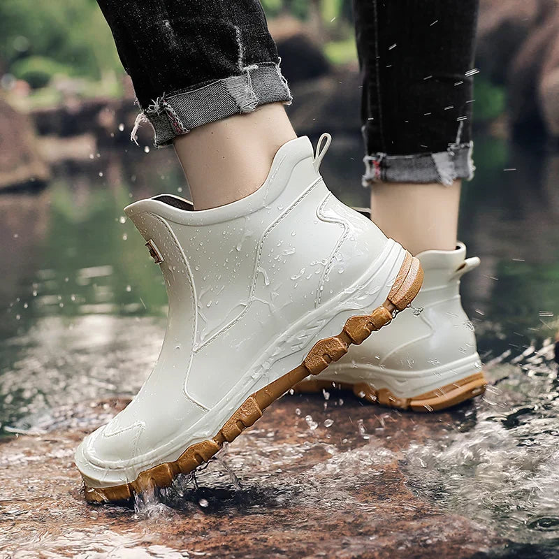 Pull-on terrain ankle boots with stitched panels and chunky textured soles
