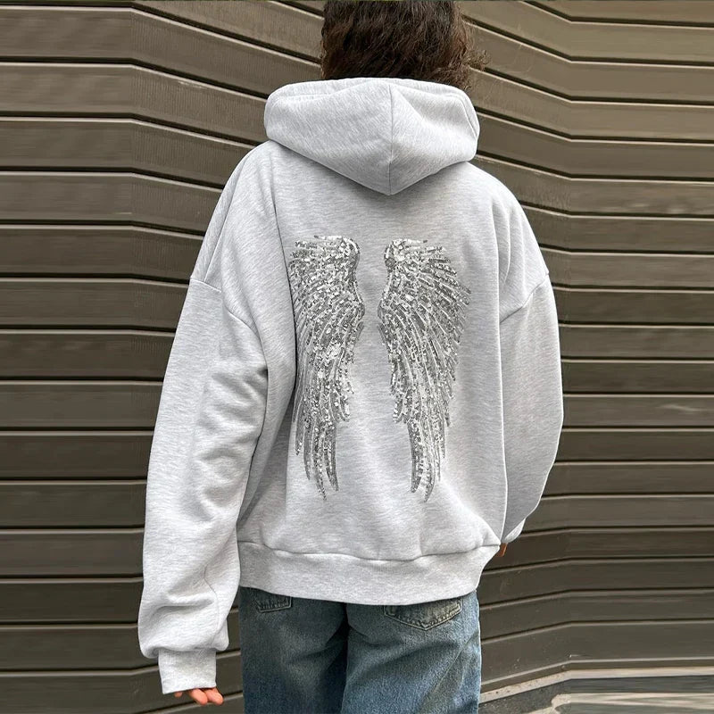 Grey hooded sweatshirt with sequin wings on the back