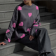 Women's patterned knit sweater with crew neck, long sleeves and contrasting motifs