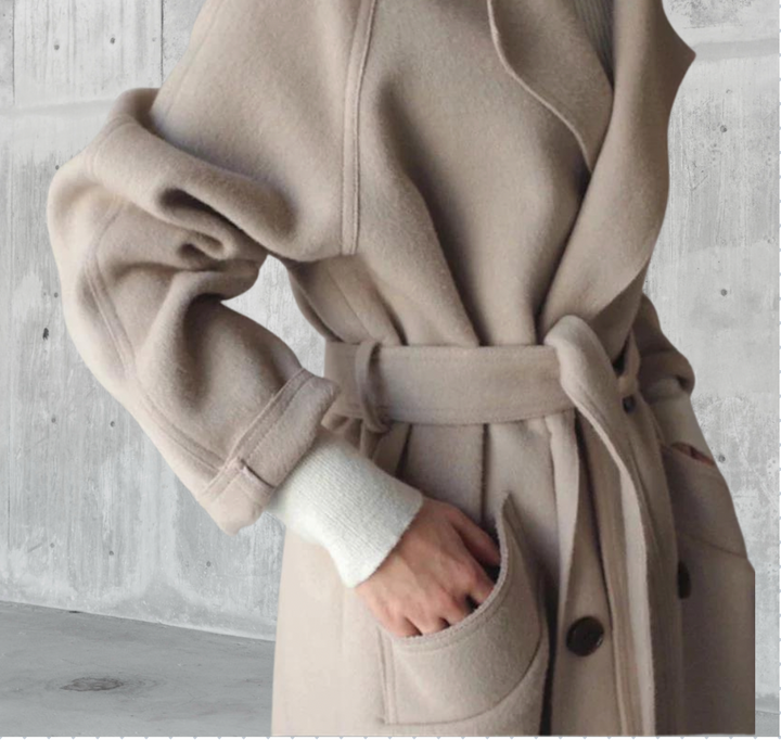 Women's longline button-front coat with notched lapels and side pockets
