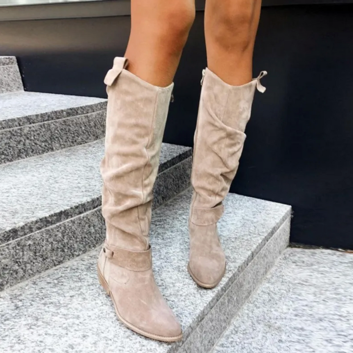 Women's high slouchy tube boots with flat heels and strap details