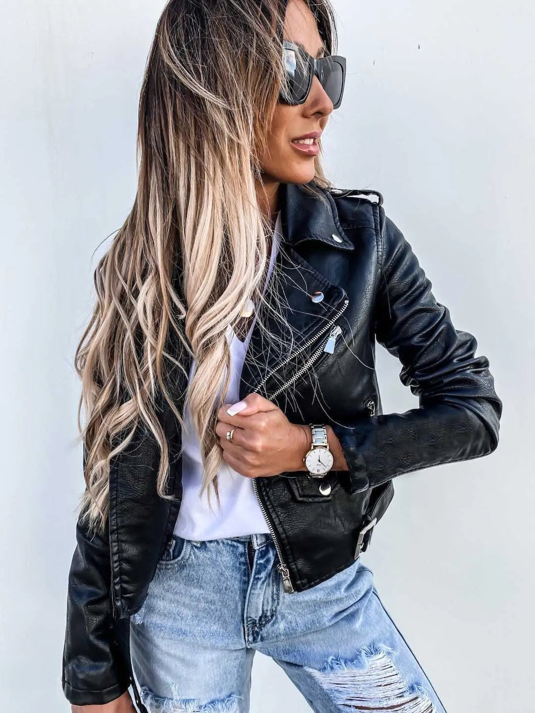 Women's cropped biker jacket with angled zip, belt and multiple pockets