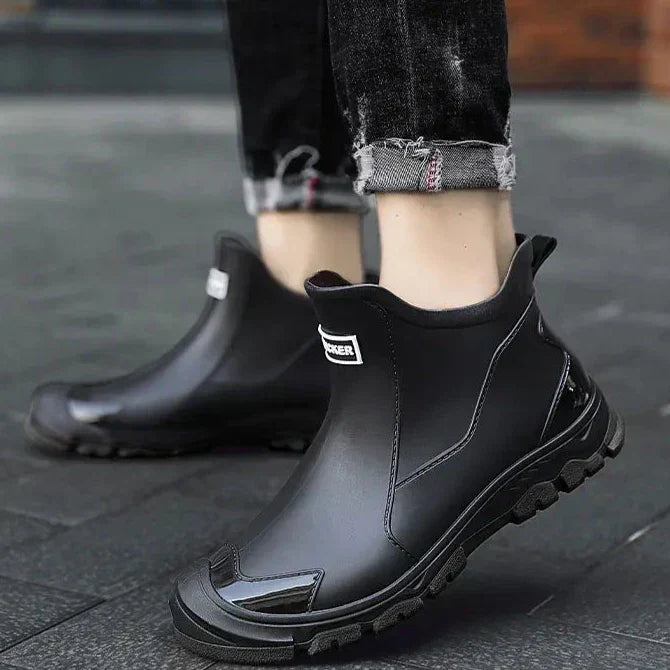 Pull-on terrain ankle boots with stitched panels and chunky textured soles