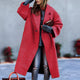 Women's long oversized lapel coat with button front and angled pockets