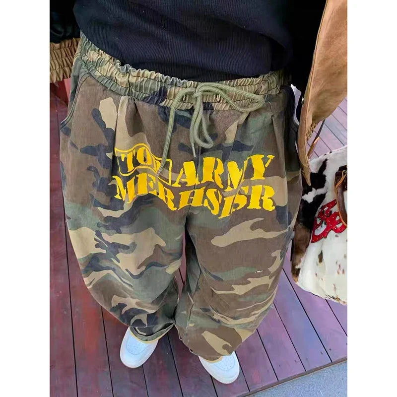 Women's wide leg camouflage trousers with drawstring waist and yellow graphic text