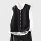 Women's sleeveless button front sweater vest layered over a shirt