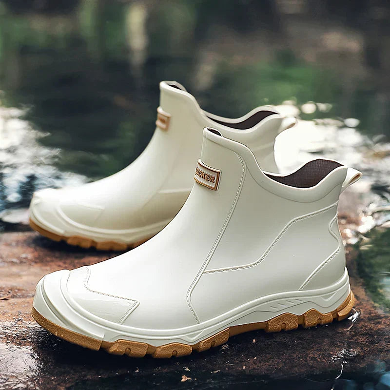 Pull-on terrain ankle boots with stitched panels and chunky textured soles