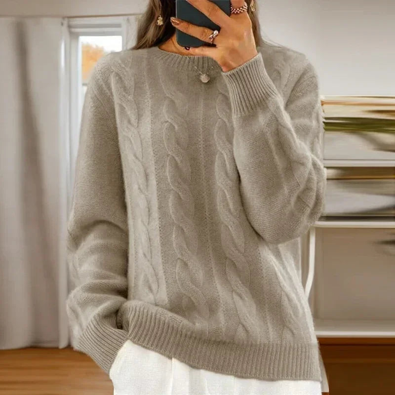 Women's cable knit crew neck sweater with long sleeves and ribbed trims