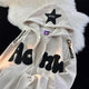 Women's hooded zip-up hoodie with raised text appliqués, star patches and kangaroo pocket