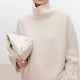 Women's plain knit turtleneck sweater with ribbed collar and long sleeves