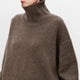 Women's plain knit turtleneck sweater with ribbed collar and long sleeves