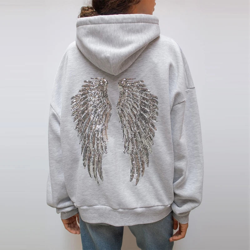 Grey hooded sweatshirt with sequin wings on the back