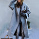 Women's long oversized lapel coat with button front and angled pockets