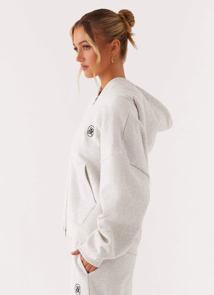 Women's grey hooded zip-up hoodie with front pockets