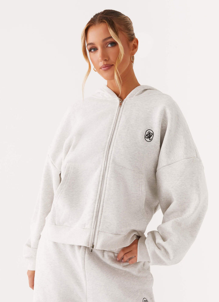 Women's grey hooded zip-up hoodie with front pockets