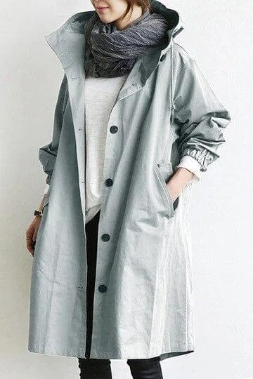 Women's hooded longline raincoat with button front and pockets