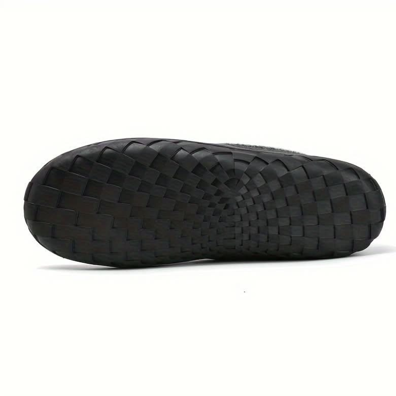 Men's lined slip-on moccasin slippers with plush trim and flat treaded soles