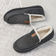 Men's lined slip-on moccasin slippers with plush trim and flat treaded soles