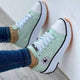 Women's low-top lace-up sneakers with platform soles and side patches