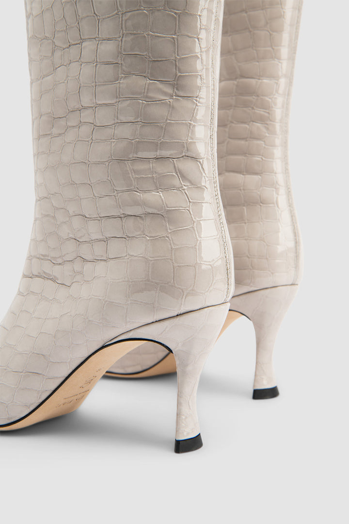 Women's beige croco embossed knee-high boots with pointed toes and stiletto heels