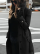 Women's belted long coat with high collar and button front