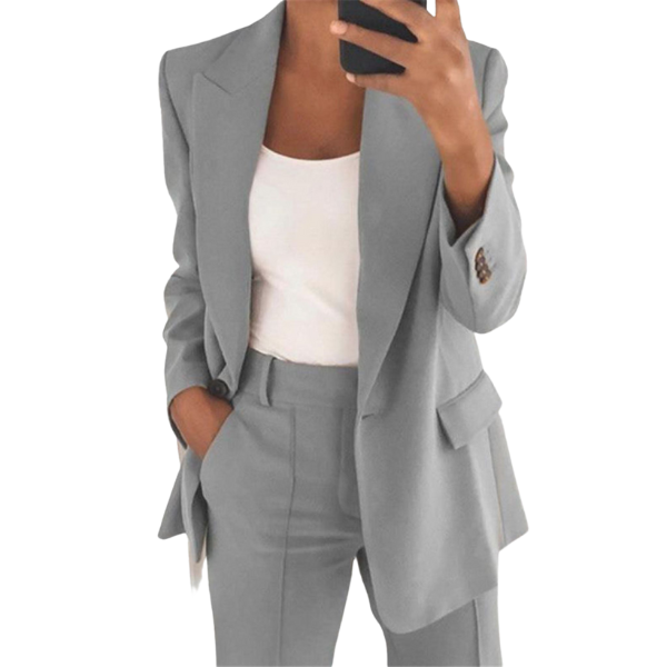 Women's tailored blazer and straight-leg trousers set with notched lapels and flap pockets