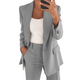 Women's tailored blazer and straight-leg trousers set with notched lapels and flap pockets
