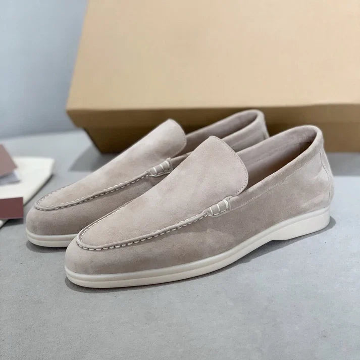 Slip-on loafers with moc-toe stitching and flat contrasting soles
