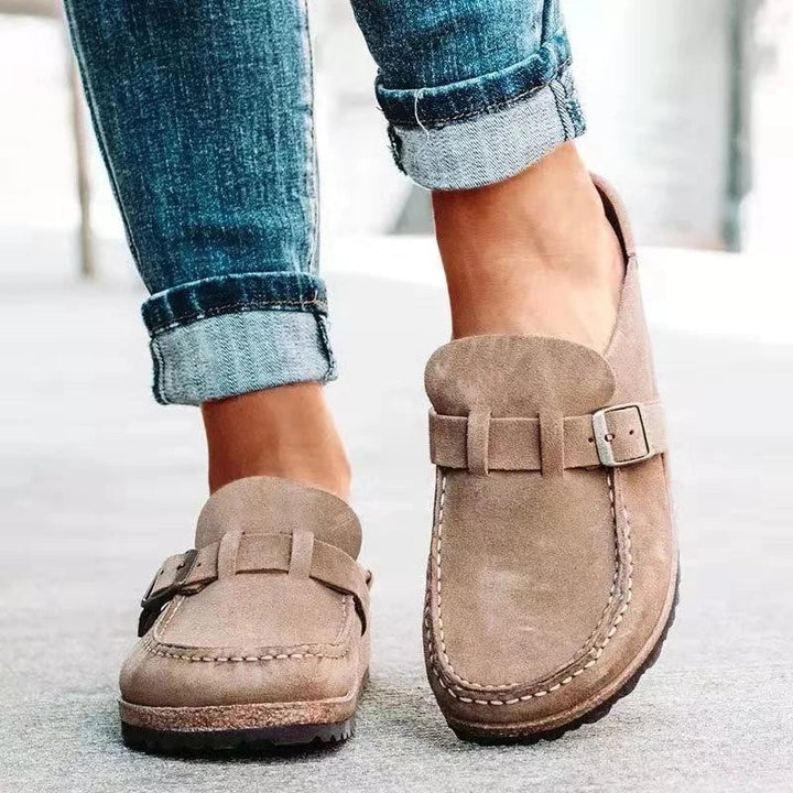 Women's slip-on loafers with buckle straps, rounded toes and flat soles